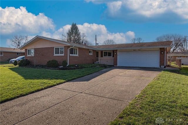 ranch-style home featuring a garage and a front lawn