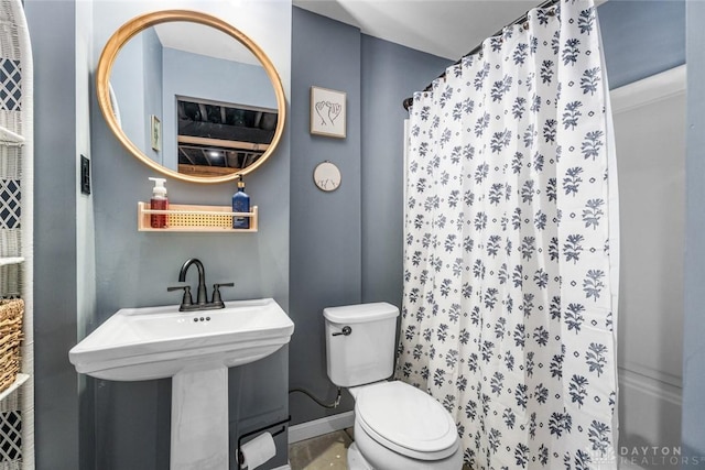 bathroom featuring toilet and sink