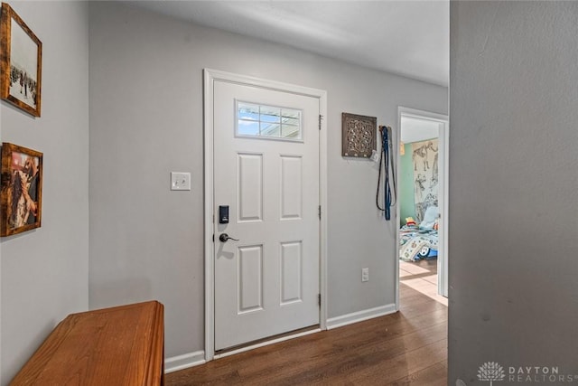 entryway with dark hardwood / wood-style floors