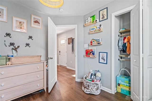 hallway with dark wood-type flooring