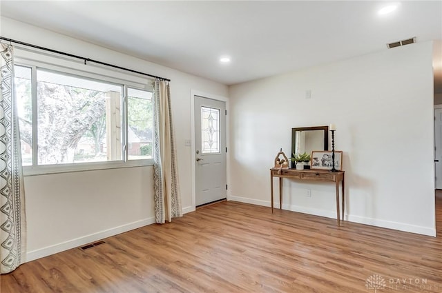 entrance foyer with light hardwood / wood-style flooring