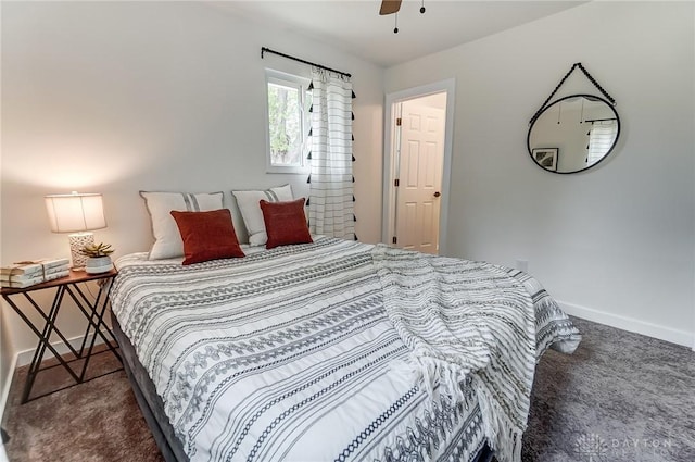 bedroom featuring dark colored carpet and ceiling fan