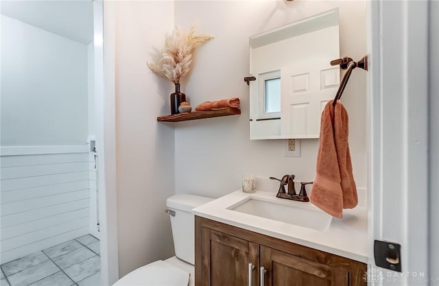 bathroom featuring vanity and toilet