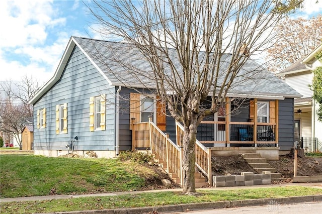 view of front of house featuring a front lawn and a porch