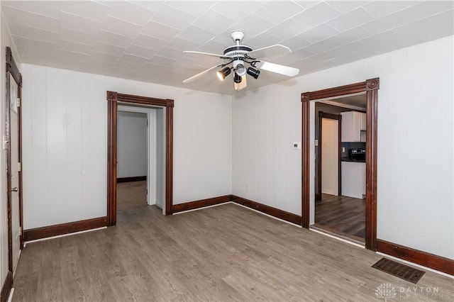 unfurnished bedroom featuring hardwood / wood-style flooring and ceiling fan