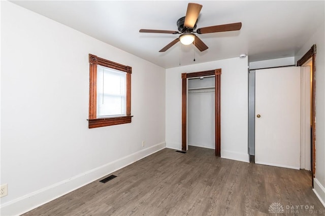 unfurnished bedroom with a closet, ceiling fan, and hardwood / wood-style floors