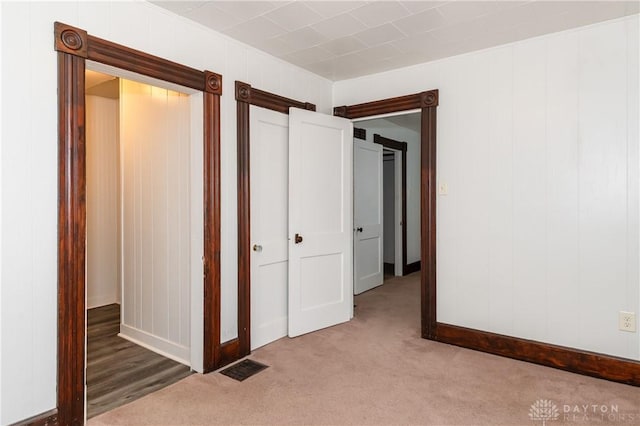 unfurnished bedroom featuring carpet flooring