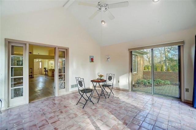 sunroom / solarium featuring vaulted ceiling with beams and ceiling fan