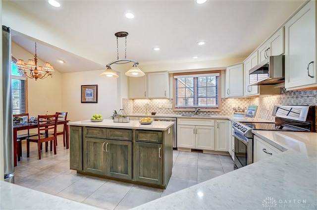 kitchen featuring pendant lighting, white cabinetry, electric stove, and sink