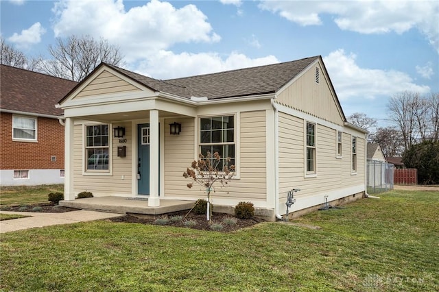 view of front of property with a porch and a front lawn