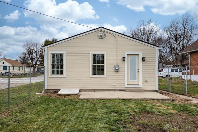 rear view of property with a lawn