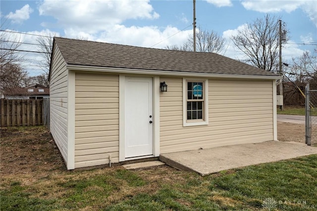 view of outdoor structure featuring a lawn