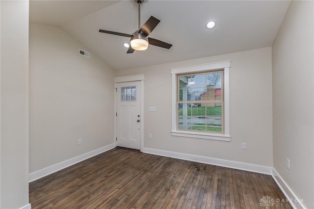 foyer entrance featuring vaulted ceiling, ceiling fan, and dark wood-type flooring