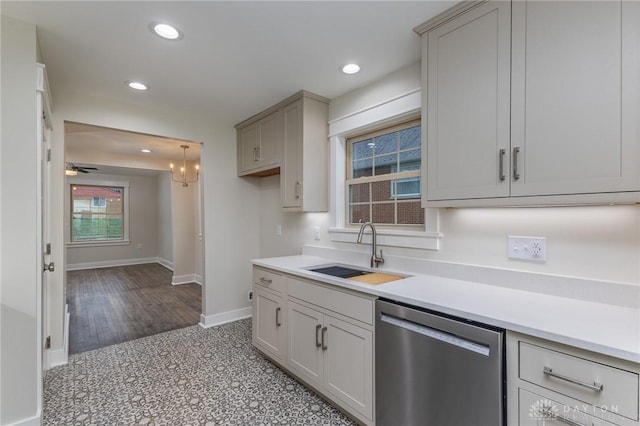 kitchen featuring pendant lighting, dishwasher, sink, ceiling fan, and gray cabinets