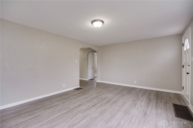 spare room with light hardwood / wood-style flooring