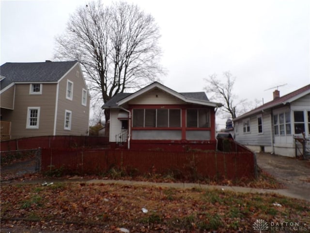 rear view of house with a sunroom