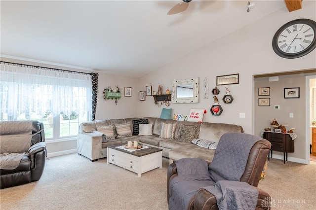 carpeted living room featuring ceiling fan and lofted ceiling