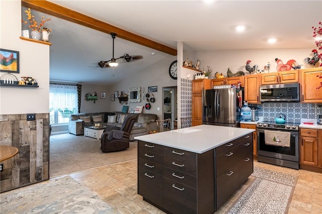 kitchen featuring a center island, lofted ceiling with beams, ceiling fan, light colored carpet, and stainless steel appliances