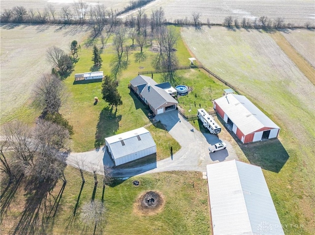 birds eye view of property with a rural view