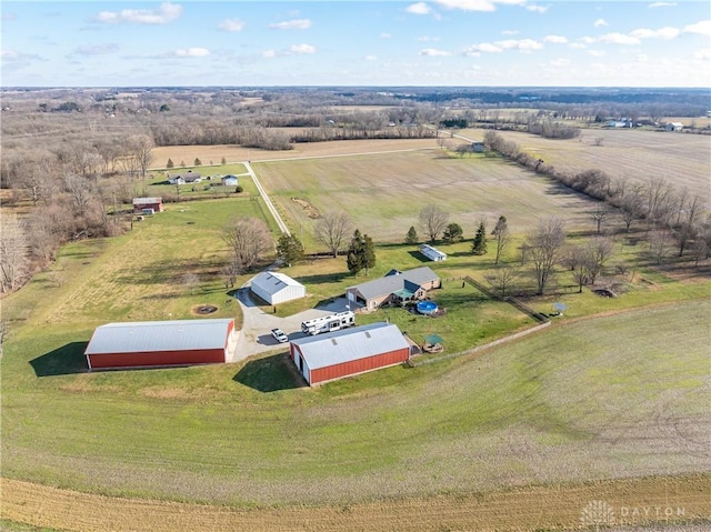 birds eye view of property with a rural view