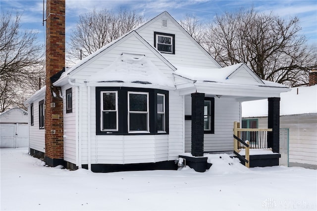 view of front of house with an outdoor structure