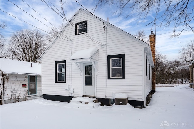 view of snow covered house