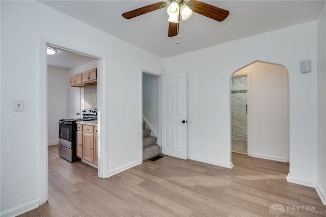 interior space featuring ceiling fan and light wood-type flooring