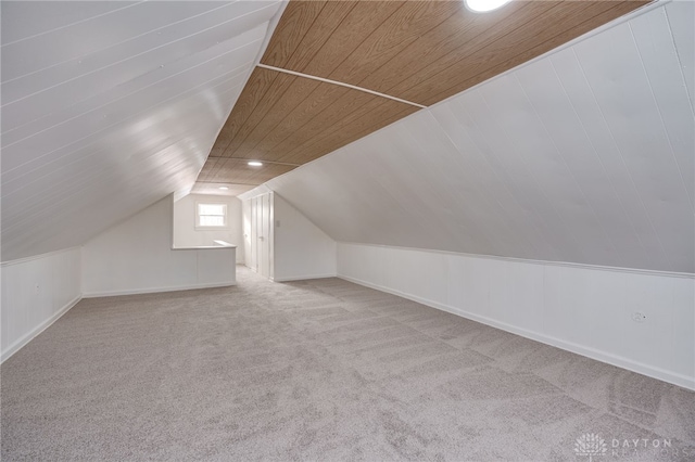 bonus room with carpet, lofted ceiling, and wooden ceiling