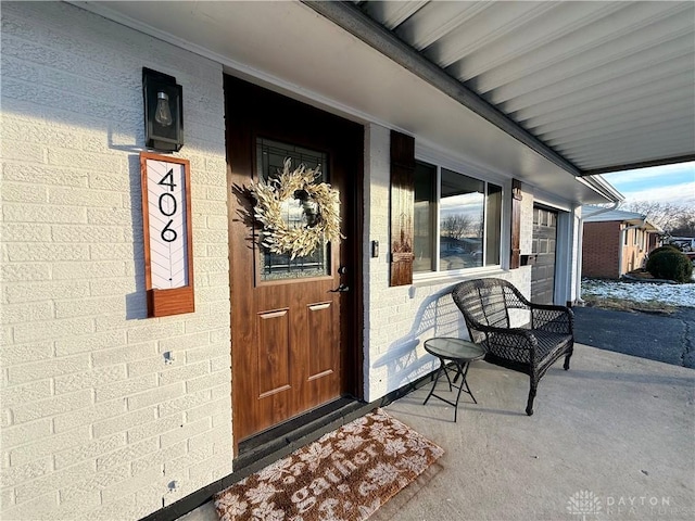 entrance to property featuring a porch