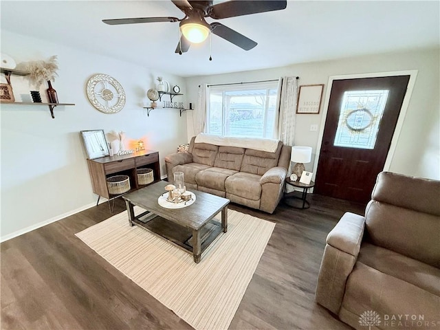 living room featuring dark hardwood / wood-style flooring and ceiling fan