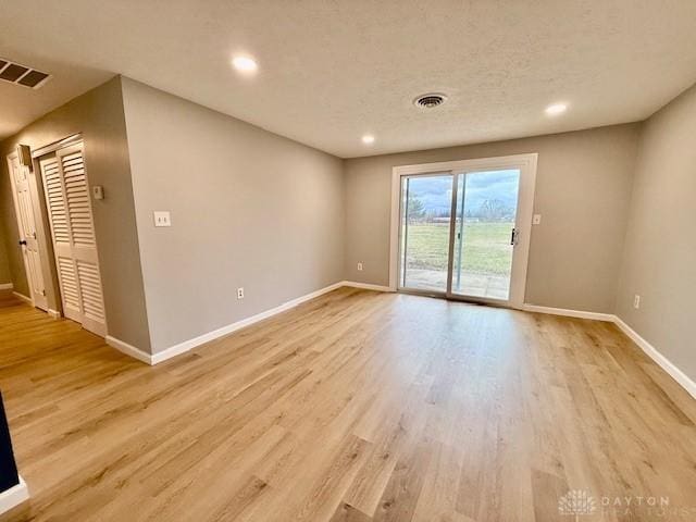 unfurnished room featuring light hardwood / wood-style flooring