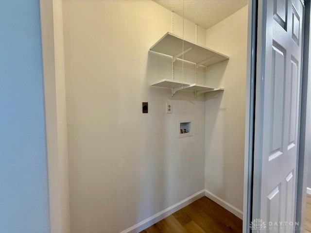 laundry room featuring hardwood / wood-style flooring, hookup for a washing machine, and hookup for an electric dryer