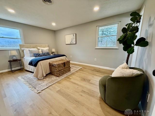 bedroom with wood-type flooring