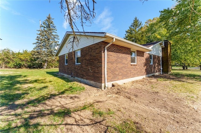 view of property exterior featuring a yard