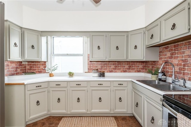 kitchen featuring dark tile patterned floors and sink