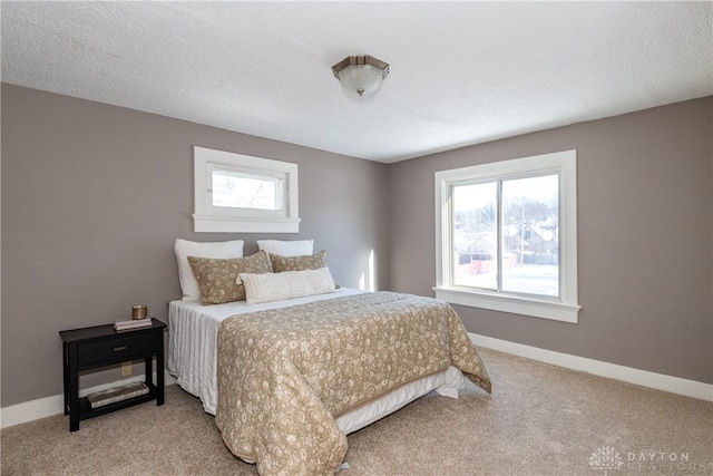 carpeted bedroom with a textured ceiling