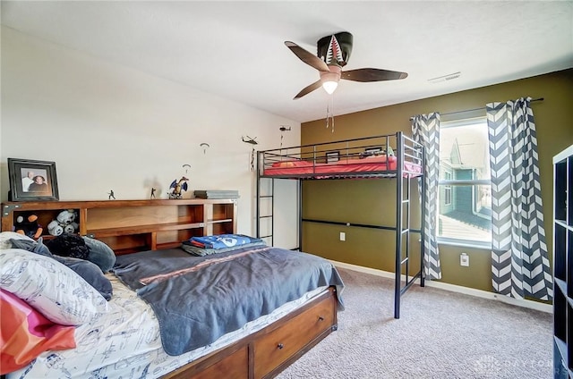 bedroom with ceiling fan and light colored carpet