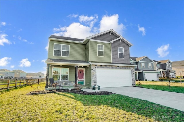 view of front of house with a front yard and a garage