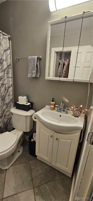 bathroom with vanity and toilet