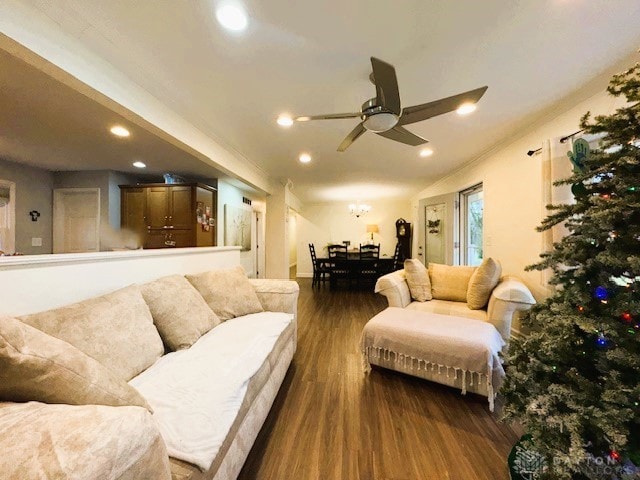 living room with ceiling fan and dark wood-type flooring