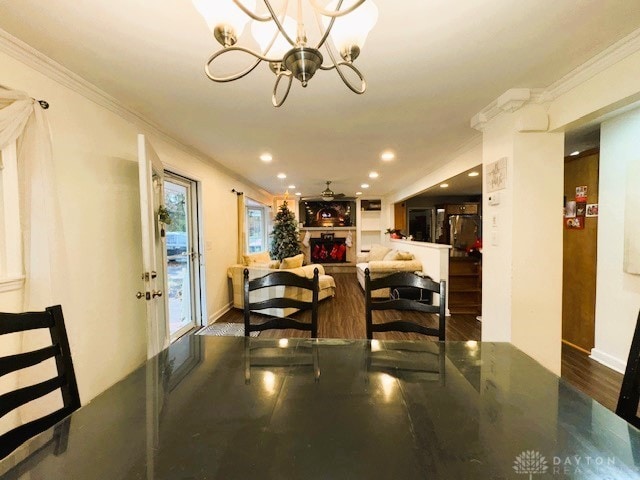 dining space with a notable chandelier and ornamental molding