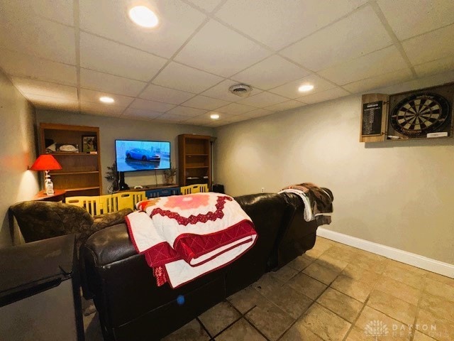 home theater room featuring a drop ceiling