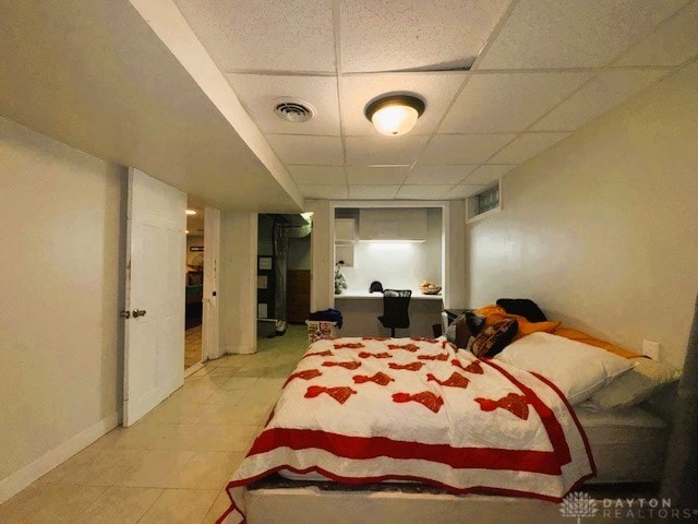 bedroom featuring a paneled ceiling