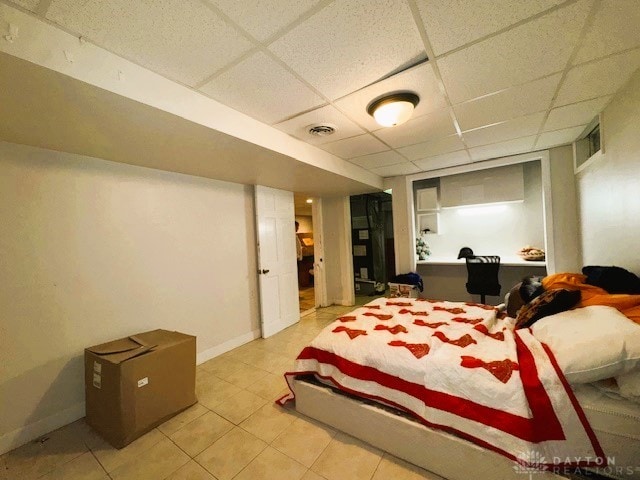 bedroom featuring a drop ceiling