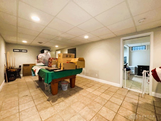 rec room featuring a paneled ceiling