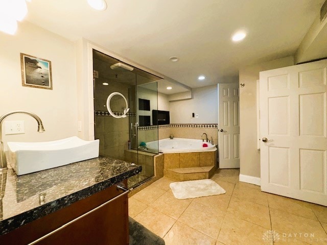 bathroom featuring vanity, tile patterned floors, and independent shower and bath