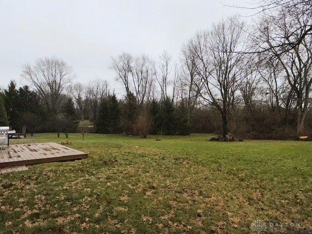 view of yard with a wooden deck