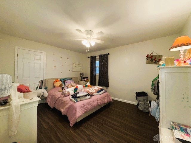 bedroom featuring ceiling fan and dark wood-type flooring