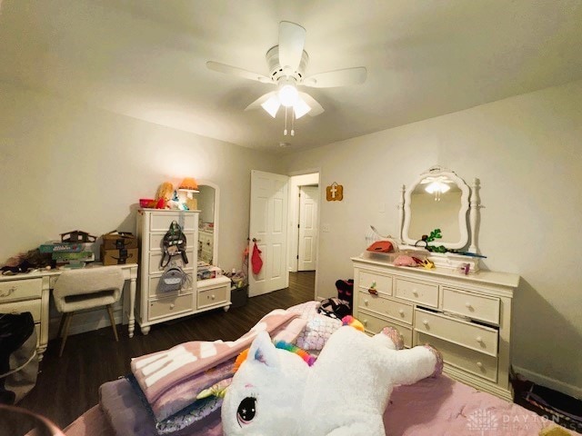 interior space with ceiling fan and dark wood-type flooring