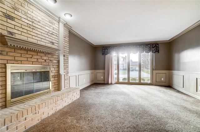 unfurnished living room with a fireplace, carpet, and ornamental molding